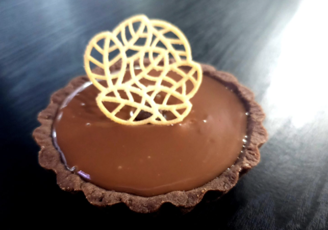 Milk Chocolate and Caramel Tart. Chocolate shortbread crust, a layer of smooth caramel finished with a layer of silky milk chocolate.